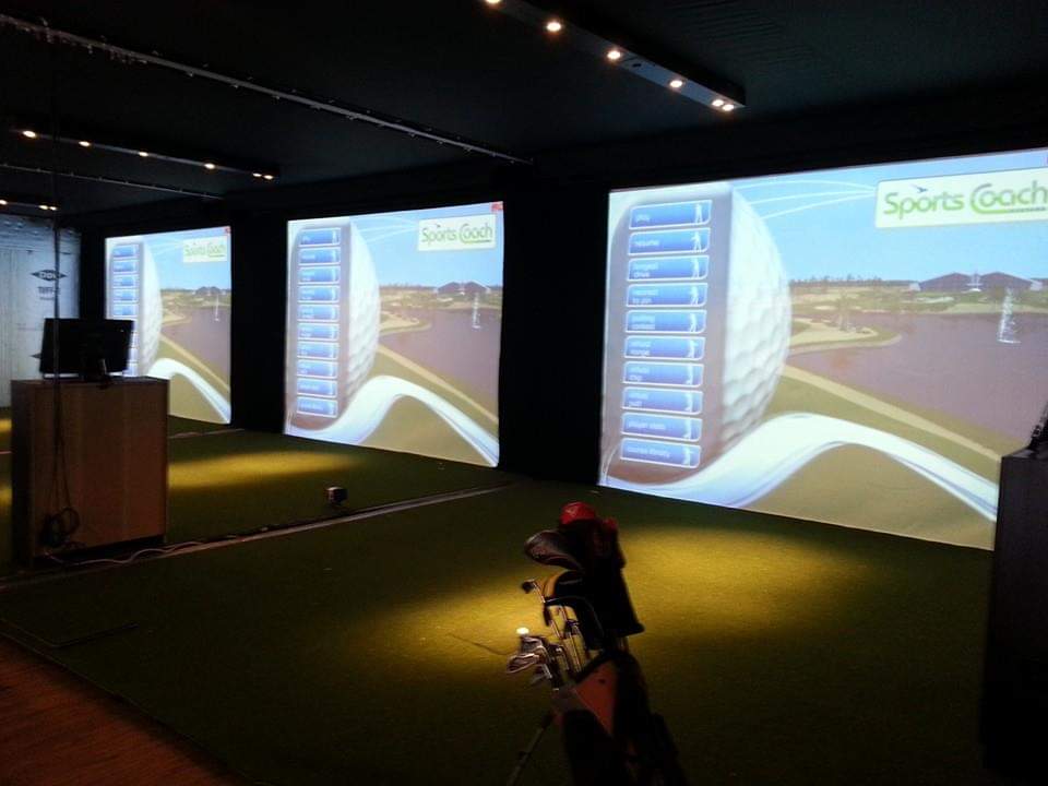 Three golf simulator screens